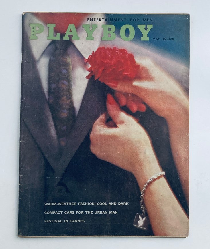 VTG Playboy Magazine May 5 1960 cover featuring a close-up of a man in a suit holding a flower with a woman's hand. Vintage magazine capturing 1960s aesthetics.