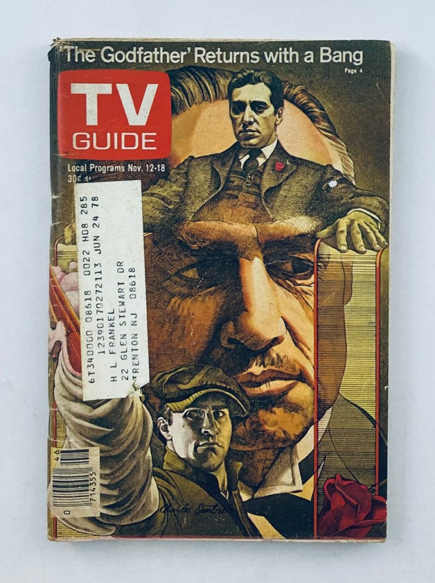Cover of TV Guide Magazine from November 12, 1977, featuring prominent images of Al Pacino and Marlon Brando. The headline reads 'The Godfather Returns with a Bang', highlighting the magazine's focus on television programming for that week.