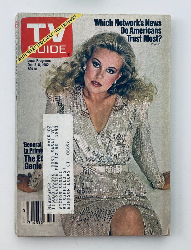 TV Guide Magazine from October 2, 1982 featuring Genie Francis on the cover, posing in a sparkling dress. This vintage magazine is labeled with local programs and sell for 50 cents.