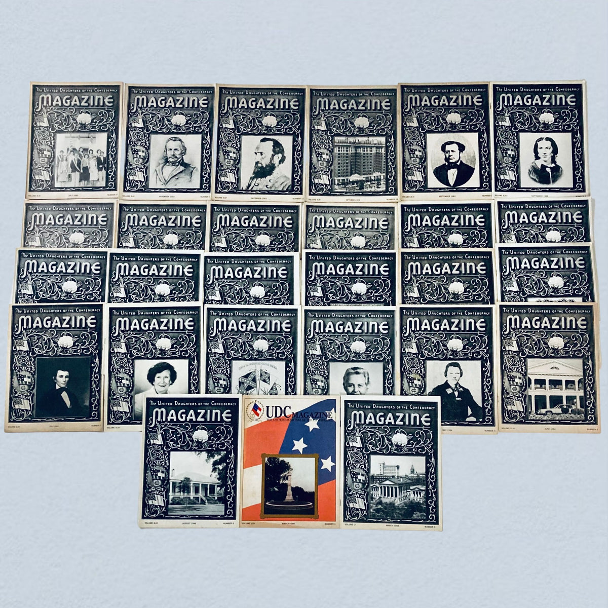 Lot of 27 vintage issues of The United Daughters of The Confederacy Magazine from the 1980s and 1990s, showcasing historical imagery and themed designs.