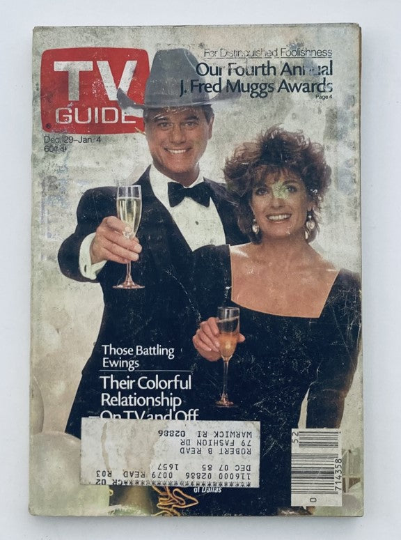 Cover of TV Guide Magazine December 29 1984 featuring Linda Gray and Larry Hagman celebrating with champagne glasses, highlighting their roles in Dallas and capturing vintage television culture.
