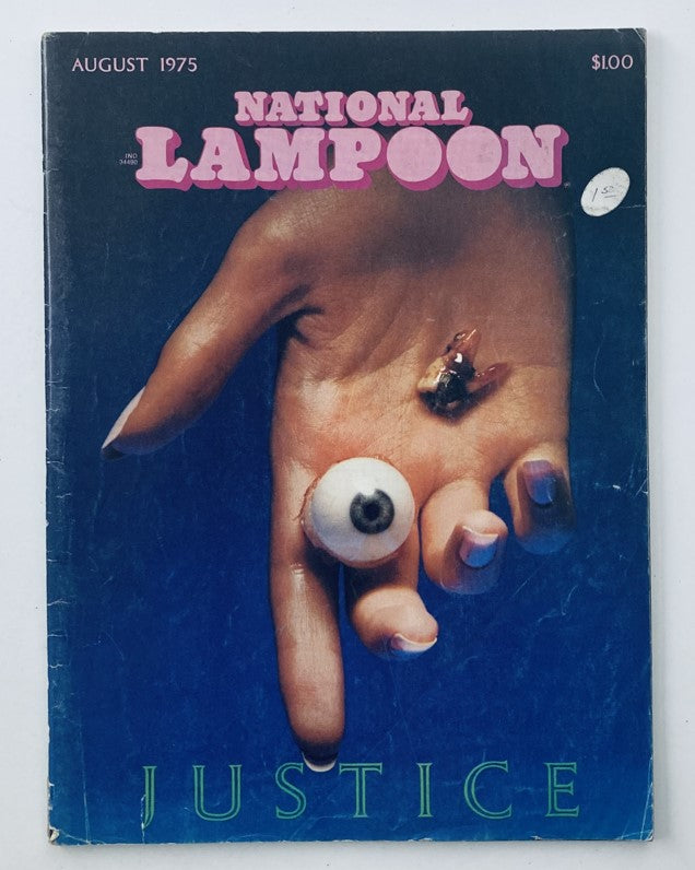Cover of Vintage National Lampoon Magazine August 1975 featuring an artistic representation of a hand holding an eye and humorously captioned with 'Justice'.