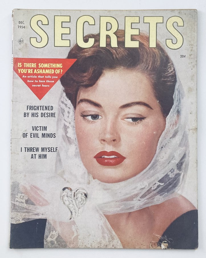 Cover of VTG Secrets Magazine December 1954, Volume 37, Number 1, featuring the headline 'Victim of Evil Minds' and an image of a woman in a veil with striking red lipstick.