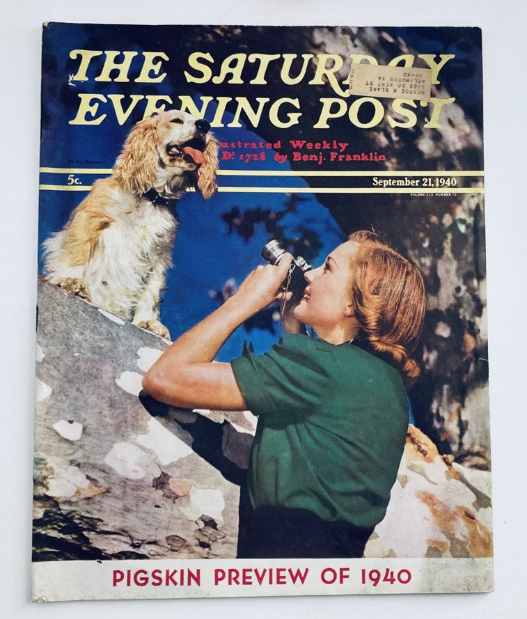 Cover of The Saturday Evening Post Magazine, September 21, 1940 featuring a woman with a camera and a dog, showcasing the "Pigskin Preview of 1940".