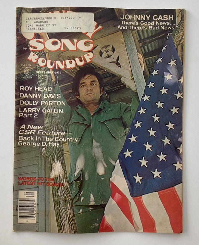 Cover of the VTG Country Song Roundup Magazine from September 1976 featuring Johnny Cash and Roy Head, showcasing the American flag and country music nostalgia.