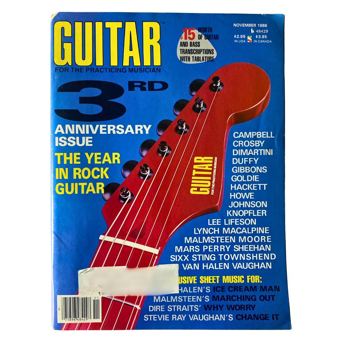 Vintage Guitar Magazine November 1986 Anniversary Issue highlighting The Year in Rock Guitar, featuring a red guitar neck graphic on the cover and iconic musician names including Stevie Ray Vaughan and Yngwie Malmsteen.