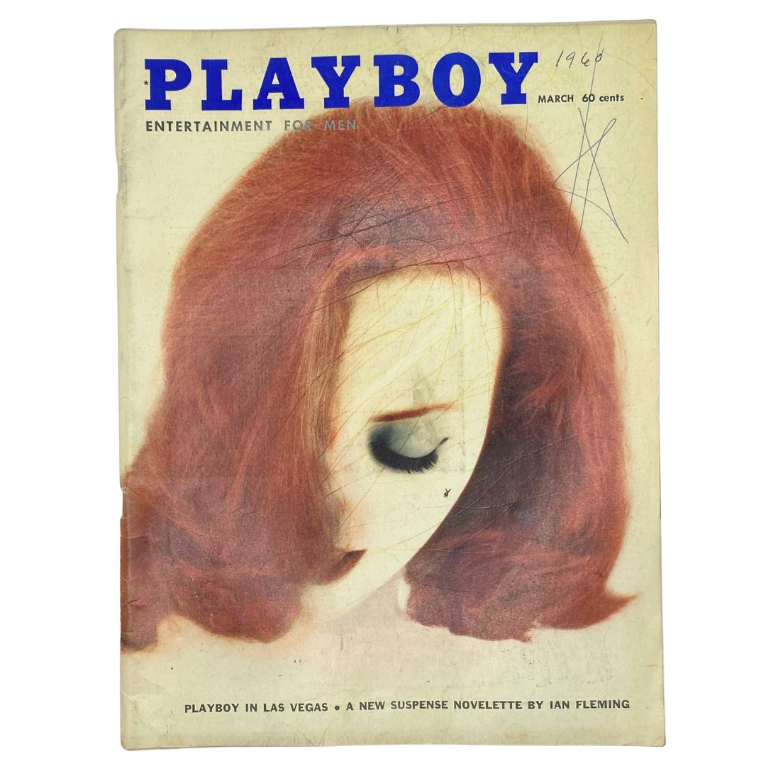 Cover of Playboy Magazine, March 1960, featuring an illustration of a woman with red hair. This vintage magazine includes Sally Sarell as the centerfold and is a collectible item showcasing 1960s pop culture.