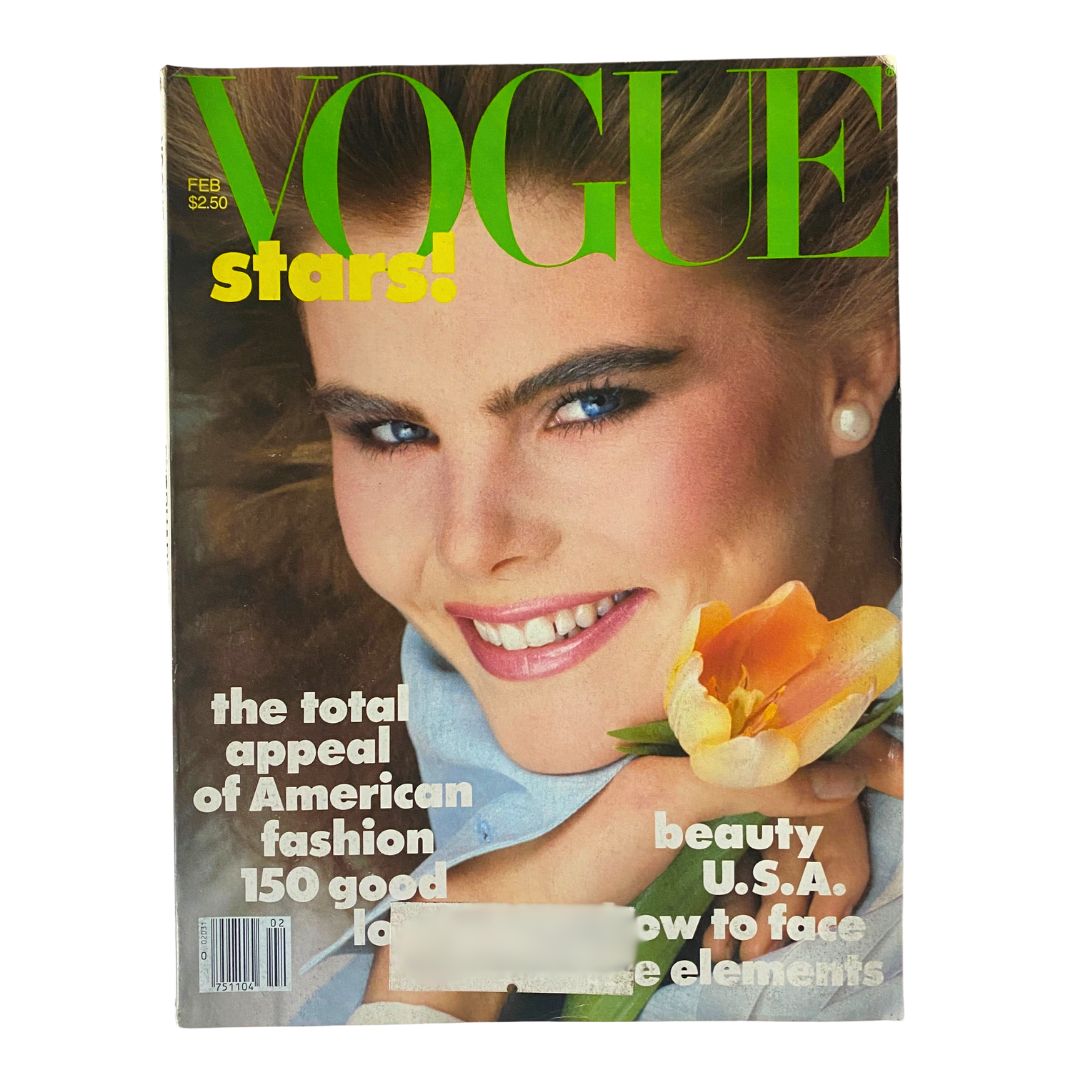 VTG Vogue Magazine February 1982 Mariel Hemingway by Bill King, featuring a close-up of a model smiling with a flower, showcasing early '80s fashion and beauty trends.