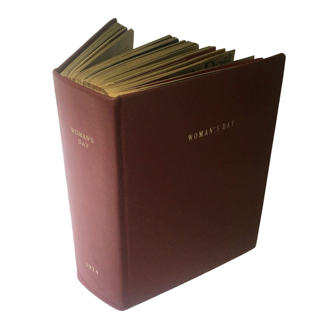Side view of the 1974 Woman's Day Magazine Complete Year Round In One Bound Book Compilation showcasing its hardcover with gold lettering and the publication year.