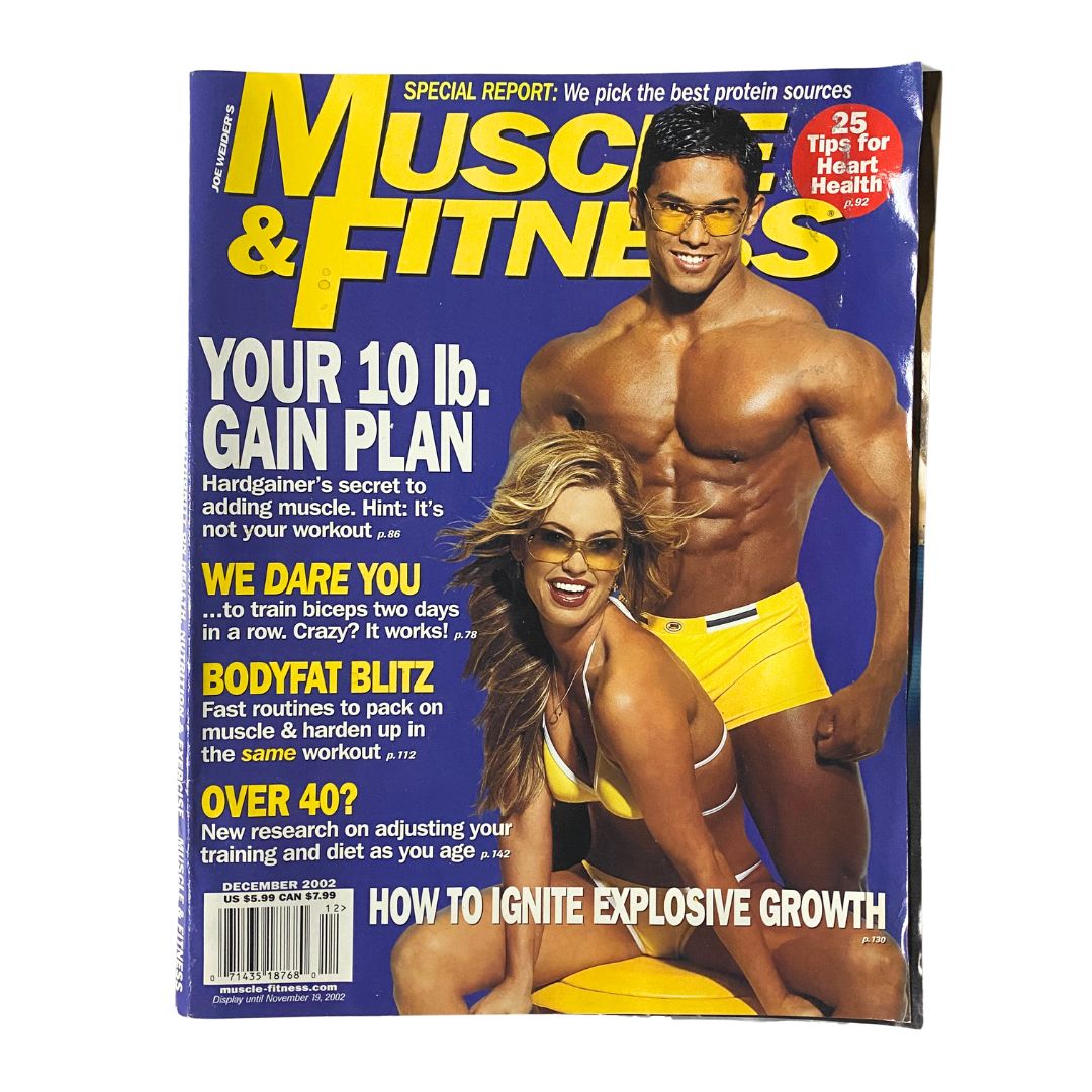 Cover of Muscle & Fitness Magazine December 2002 featuring fitness model Stan McQuay, showcasing fitness tips and bodybuilding advice.
