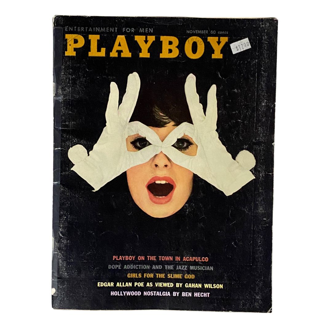 Vintage Playboy Magazine November 1960 featuring Playmate Joni Mattis on the cover, showcasing a striking design with a woman wearing white gloves and an expressive gesture.