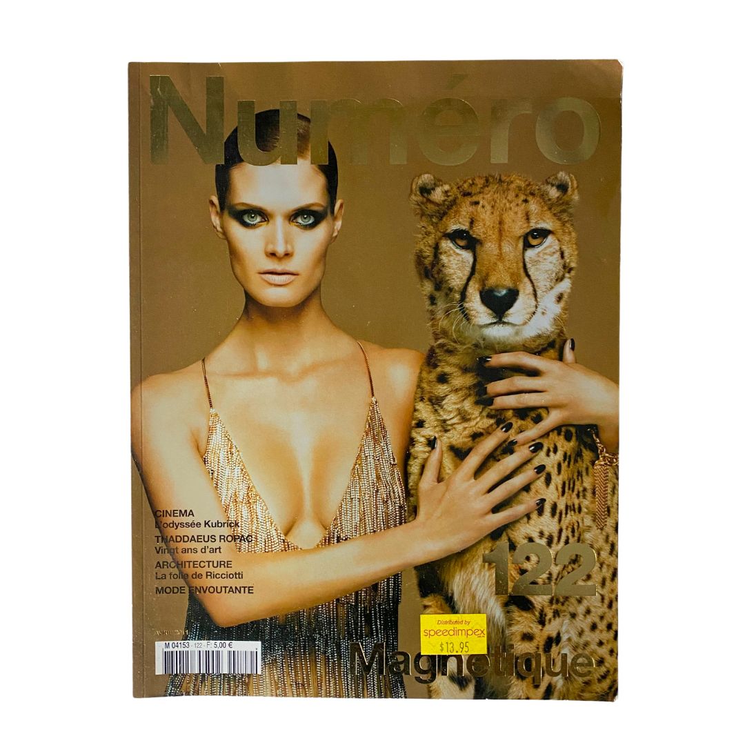 Numéro Magazine April 2011 #122 featuring model Malgosia Bela on the cover, showcasing high fashion with an elegant design and a powerful leopard.