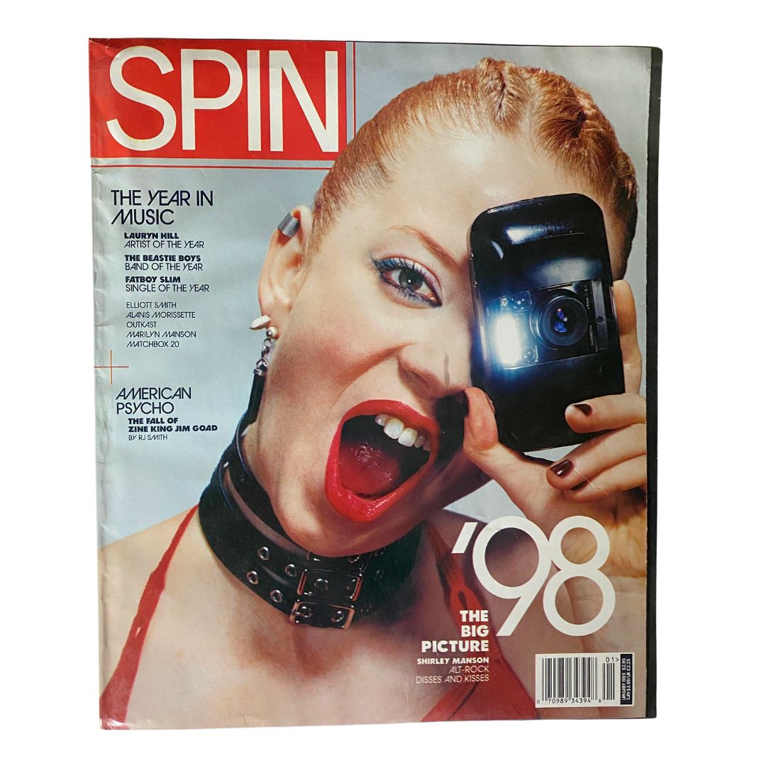 Spin Magazine January 1999 issue featuring Shirley Manson on the cover, showcasing her iconic look and bold expression as she holds a camera, representing a pivotal moment in 1998 music culture.