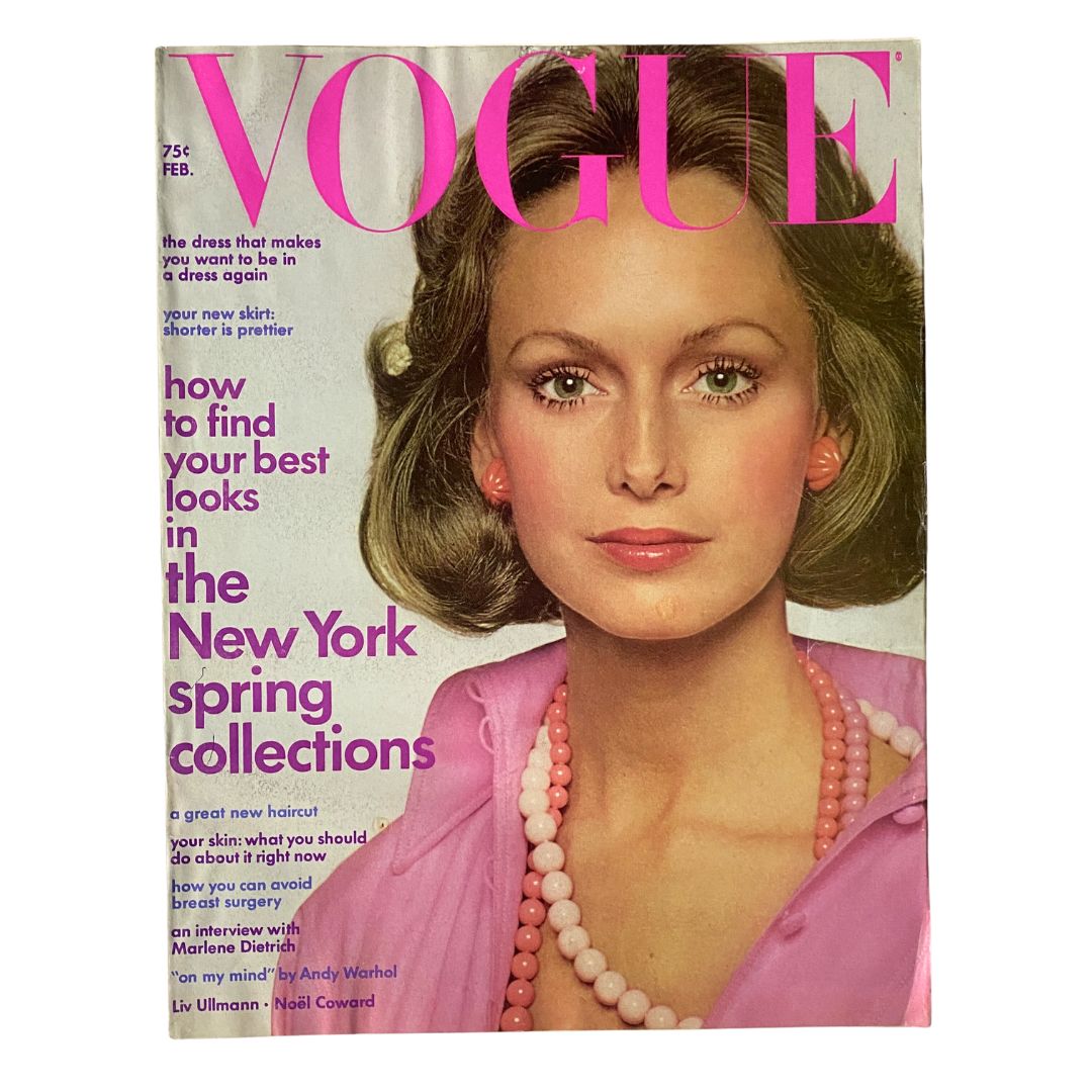VTG Vogue Magazine February 1973 featuring stunning cover shot of a model with elegant hairstyle and jewelry, showcasing high-fashion styles and iconic 1970s design.