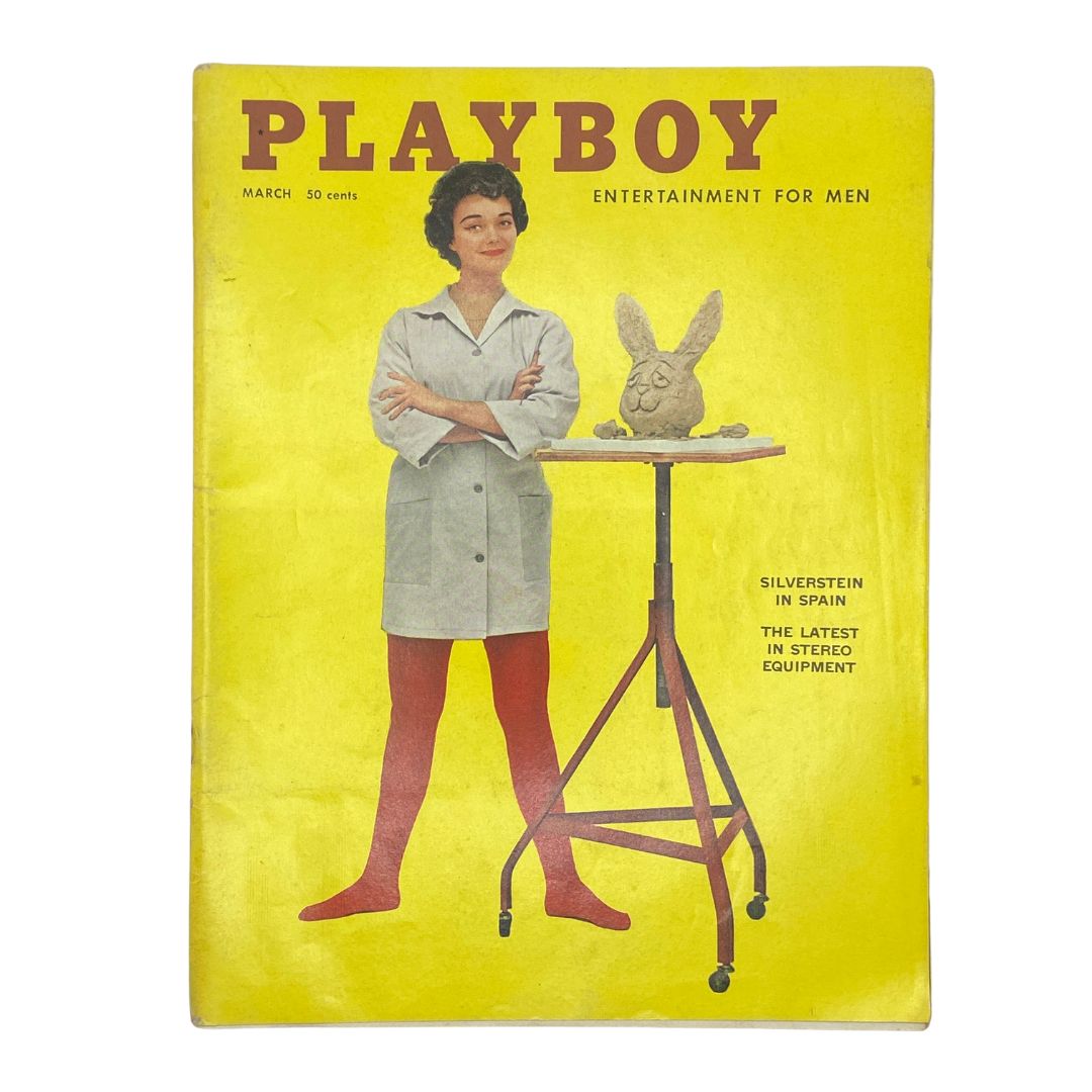 VTG Playboy Magazine March 1959 cover featuring a woman with short hair, wearing a lab coat and red tights, posing with a sculpture and a bright yellow background.