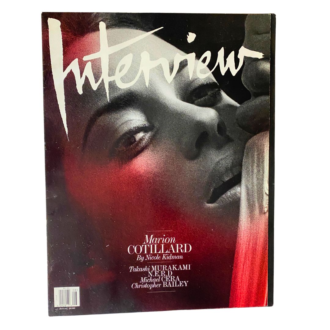 Interview Magazine August 2010 featuring Marion Cotillard cover photo by Nicole Kidman, showcasing a glamorous black and white design.