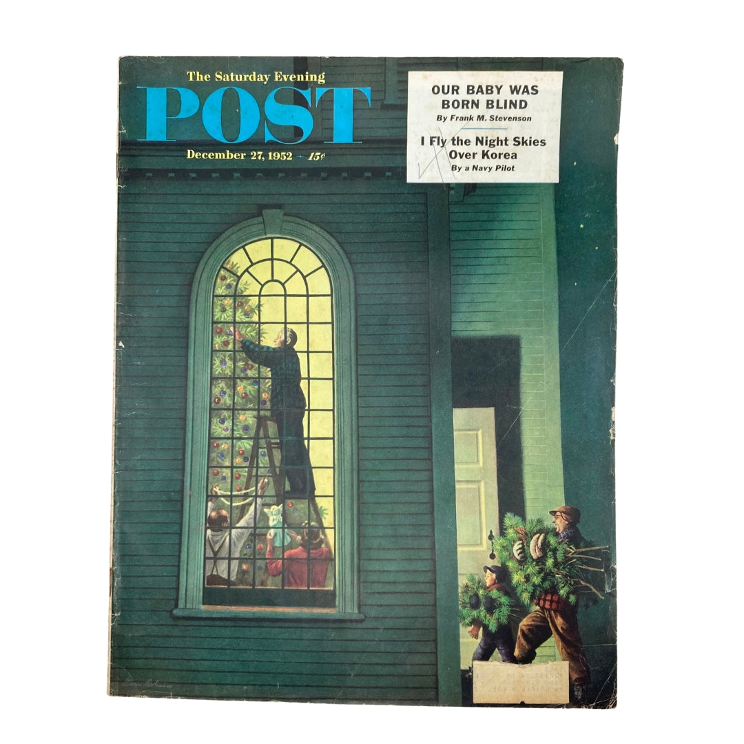 Cover of the Saturday Evening Post Magazine December 27, 1952 featuring Christmas artwork titled 'Abroad in the Land' by Dohanos, depicting a festive scene with holiday decorations.