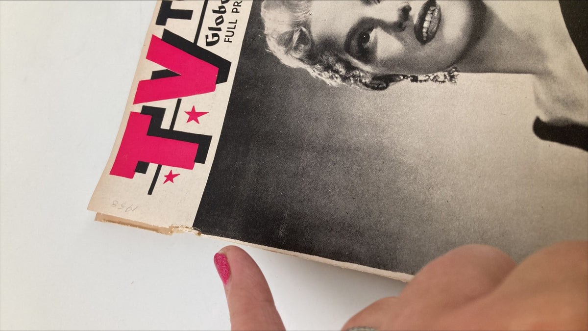 Close-up of the TV Topics Globe and Mail Magazine April 5, 1958, showing damage to the binding and highlighting its vintage condition.