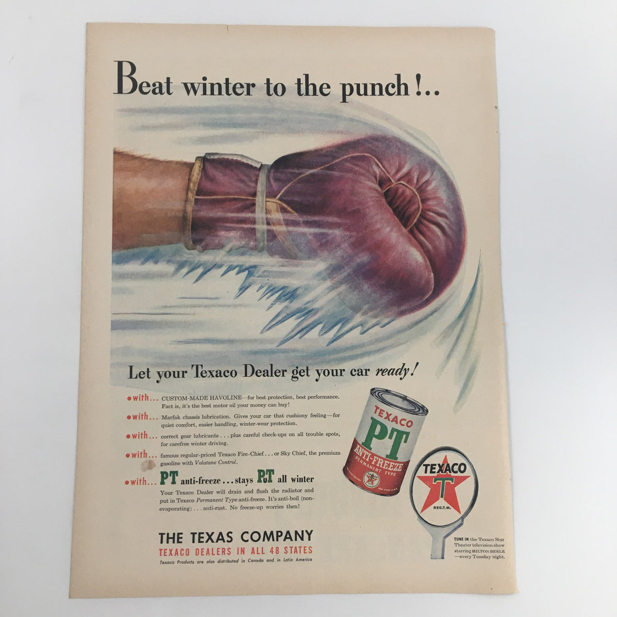1950 Texaco PT Anti-Freeze Vintage Print Ad showcasing a boxer delivering a punch, accompanied by the promotional text 'Beat winter to the punch' to highlight the importance of vehicle readiness during winter months.