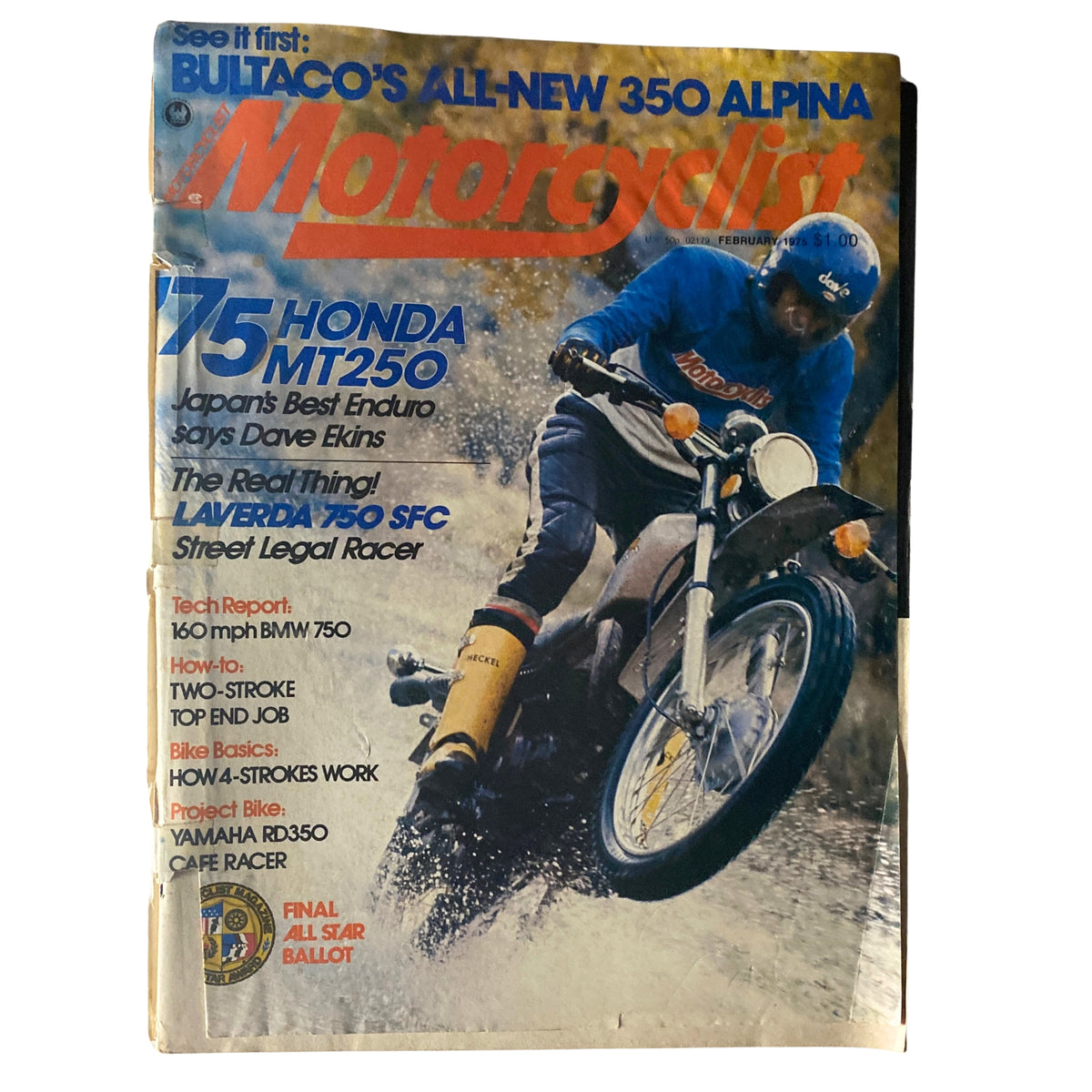 Cover of Motorcyclist Magazine February 1975 featuring the Honda MT250, showcasing a rider on a motorcycle in a muddy setting, promoting features on the Laverda 750 SFC and Bultaco 350 Alpina.