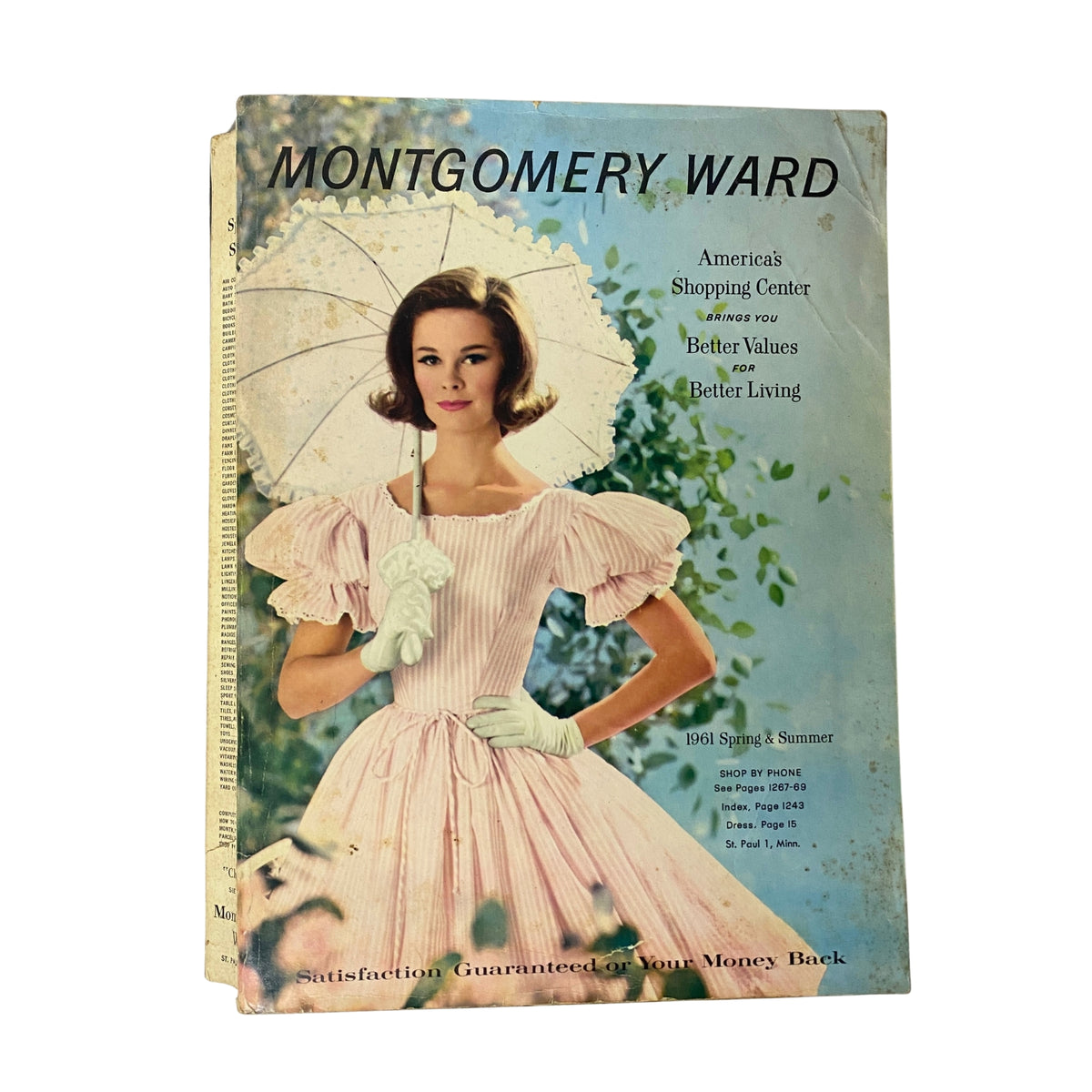 1961 Montgomery Ward Spring and Summer Catalog Cover featuring a young woman in a pink dress holding a white umbrella, showcasing mid-century fashion.