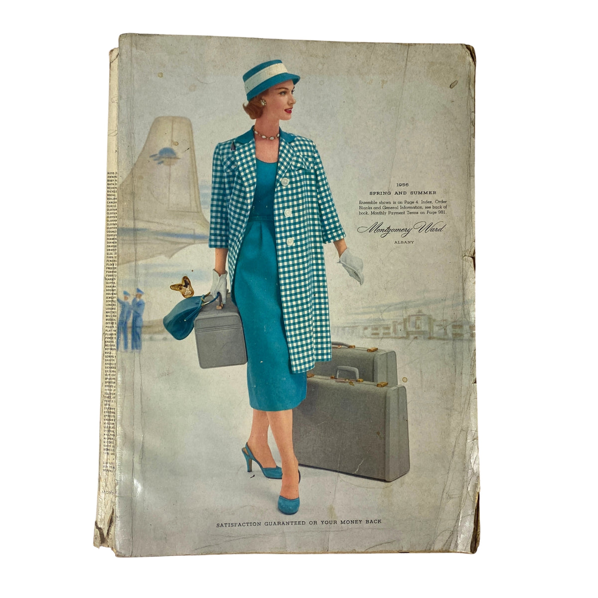 Cover of the 1956 Montgomery Ward Spring and Summer Catalog featuring a model in a stylish turquoise dress and matching coat against a vintage backdrop.