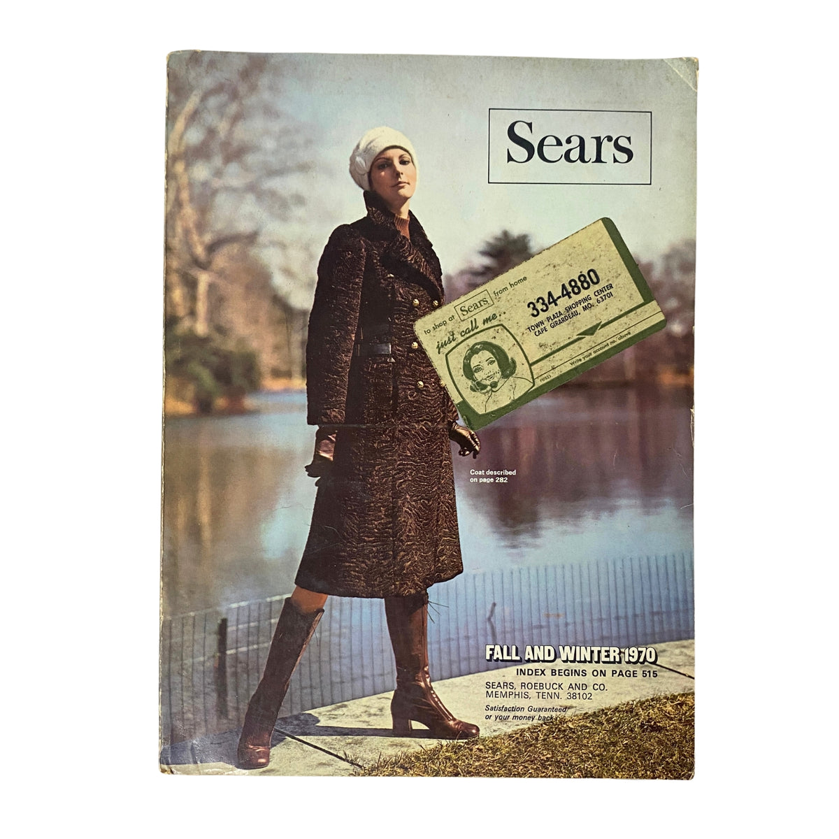 Cover of the 1970 Sears Roebuck and Co. Fall and Winter Catalog featuring a model in a stylish brown coat and white hat by a lake, showcasing vintage fashion styles.