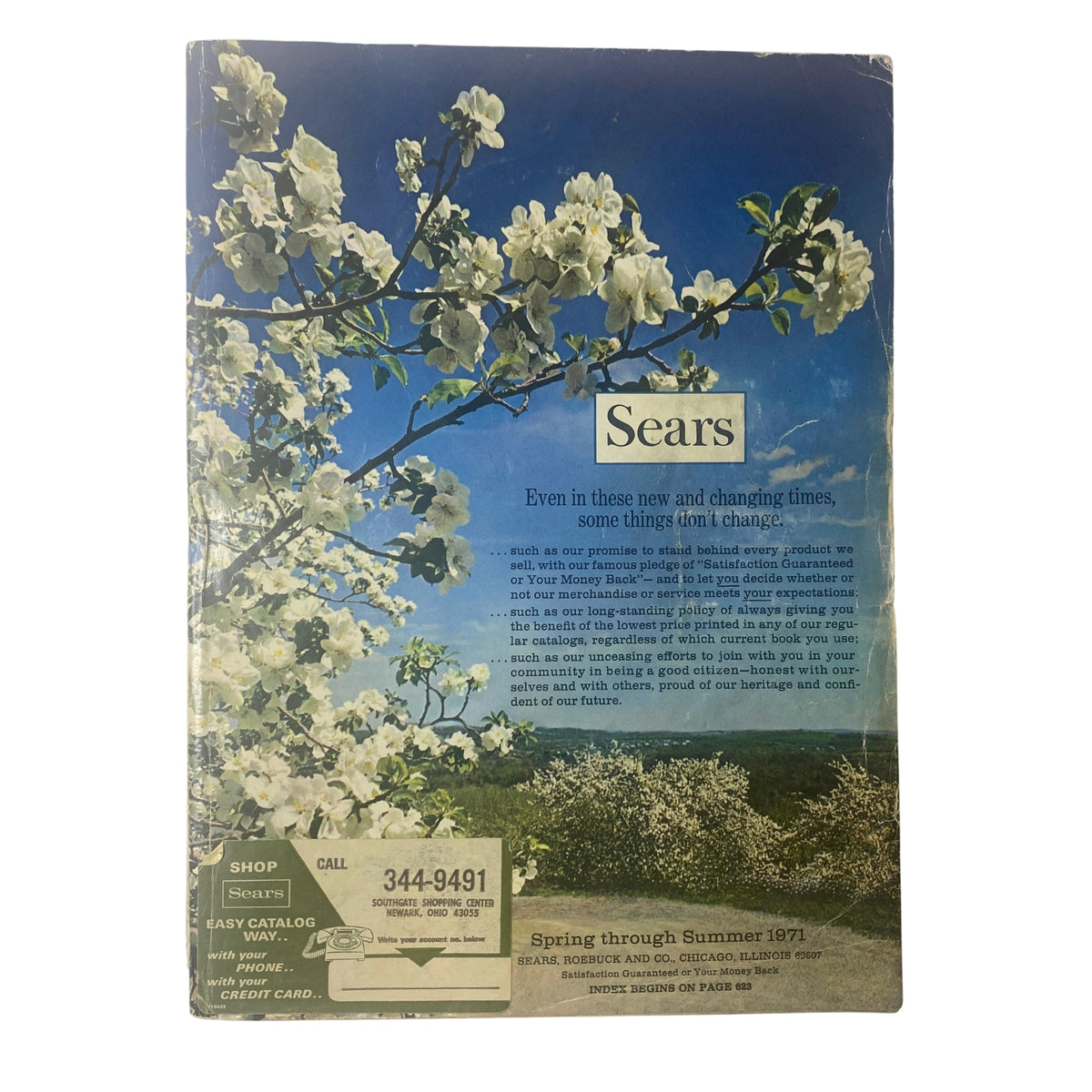 Cover of the 1971 Sears Roebuck and Co. Spring and Summer Catalog featuring blooming flowers against a clear blue sky, highlighting vintage design aesthetics and consumer culture of the early 1970s.
