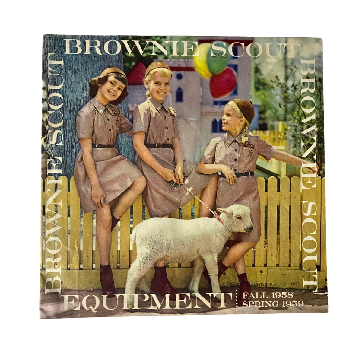 Vintage Brownie Scout Equipment Fall 1958 Spring 1959 Catalog cover featuring three girls in Brownie Scout uniforms with a white lamb, showcasing mid-century scouting culture.
