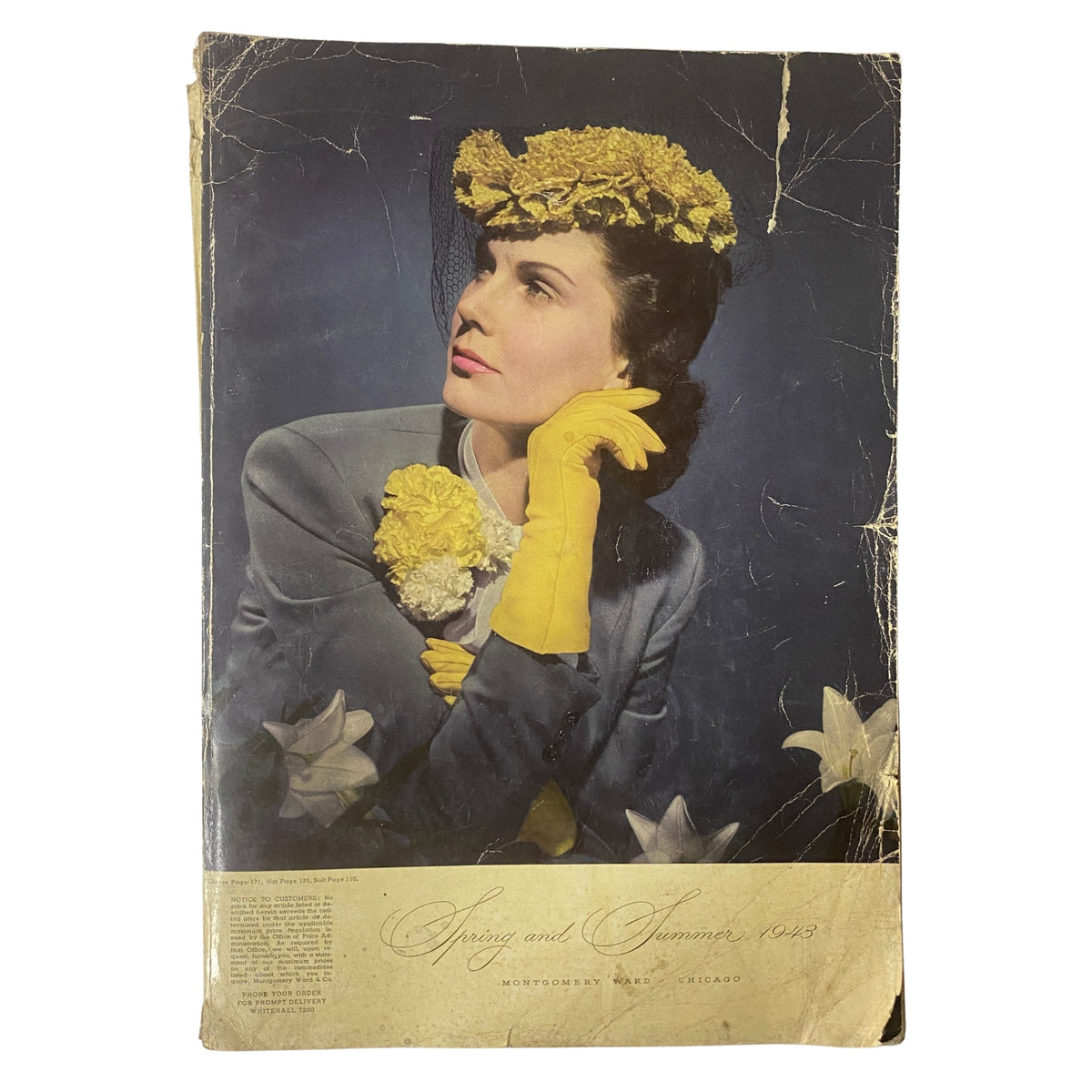 Cover of the 1943 Montgomery Ward Spring and Summer Catalog featuring a woman in a stylish ensemble with a floral hat and yellow gloves, embodying wartime fashion.