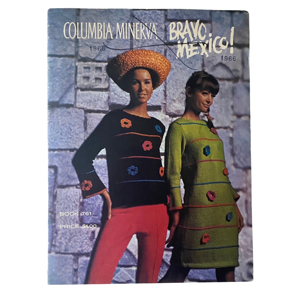1966 Columbia Minerva Bravo Mexico Knits Pattern Book featuring two models in vibrant knitted dresses and a decorative hat against a stone wall backdrop.