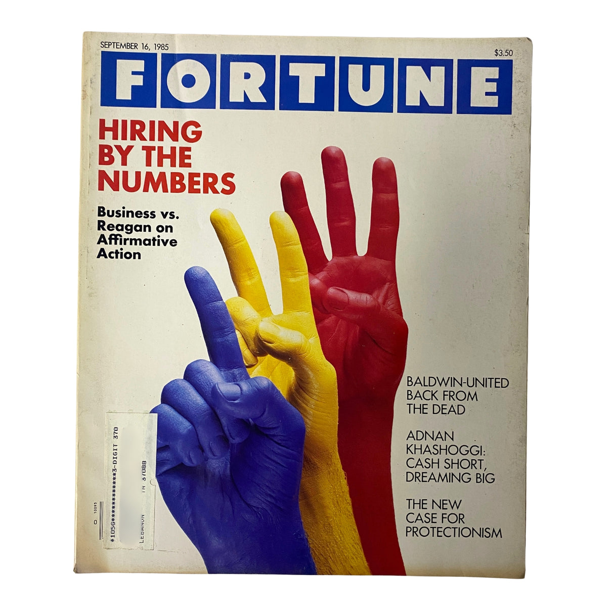 Cover of Fortune Magazine from September 16, 1985, titled 'Hiring By The Numbers.' The cover features colorful painted hands raised in a peace sign symbolizing business themes of the era, focusing on hiring practices and affirmative action.