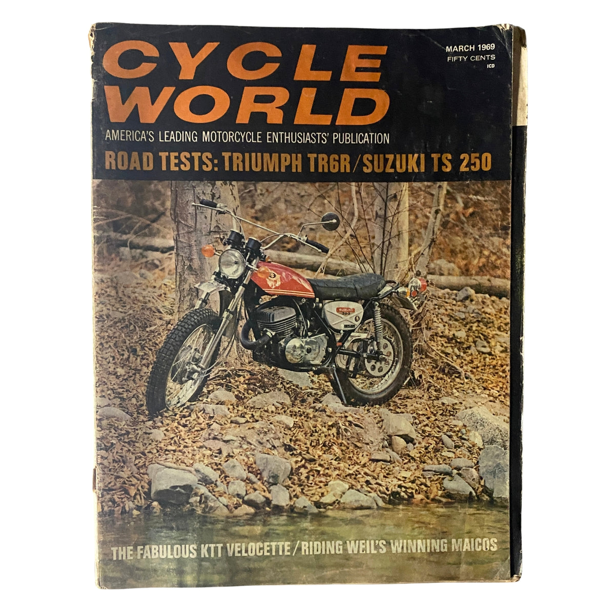Cycle World Magazine March 1969 cover featuring road tests of the Triumph TR6R and Suzuki TS 250, showcasing a motorcycle parked in a natural setting with autumn leaves in the background.