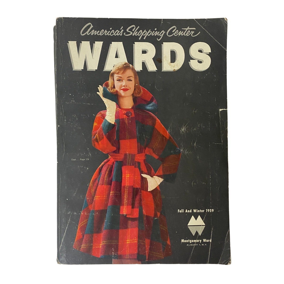 Front cover of the 1959 Montgomery Ward Fall and Winter Catalog featuring a model in a stylish red plaid coat, highlighting mid-century fashion.
