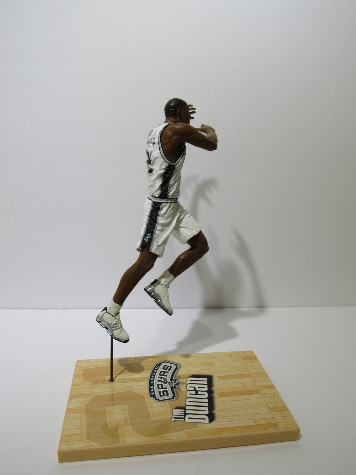 McFarlane NBA Series 6 Loose Figure: Tim Duncan leaping, emphasizing realistic pose and quality detailing.