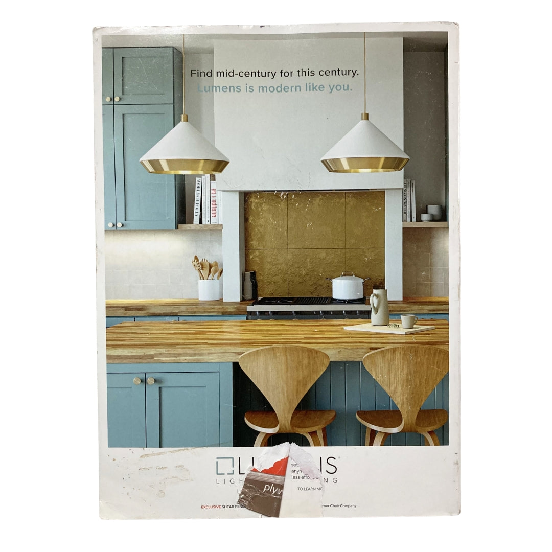 Back cover of Atomic Ranch Magazine 2021 The Renovation Guide Retro Rescues featuring a mid-century modern kitchen design with stylish lighting and furniture accents.