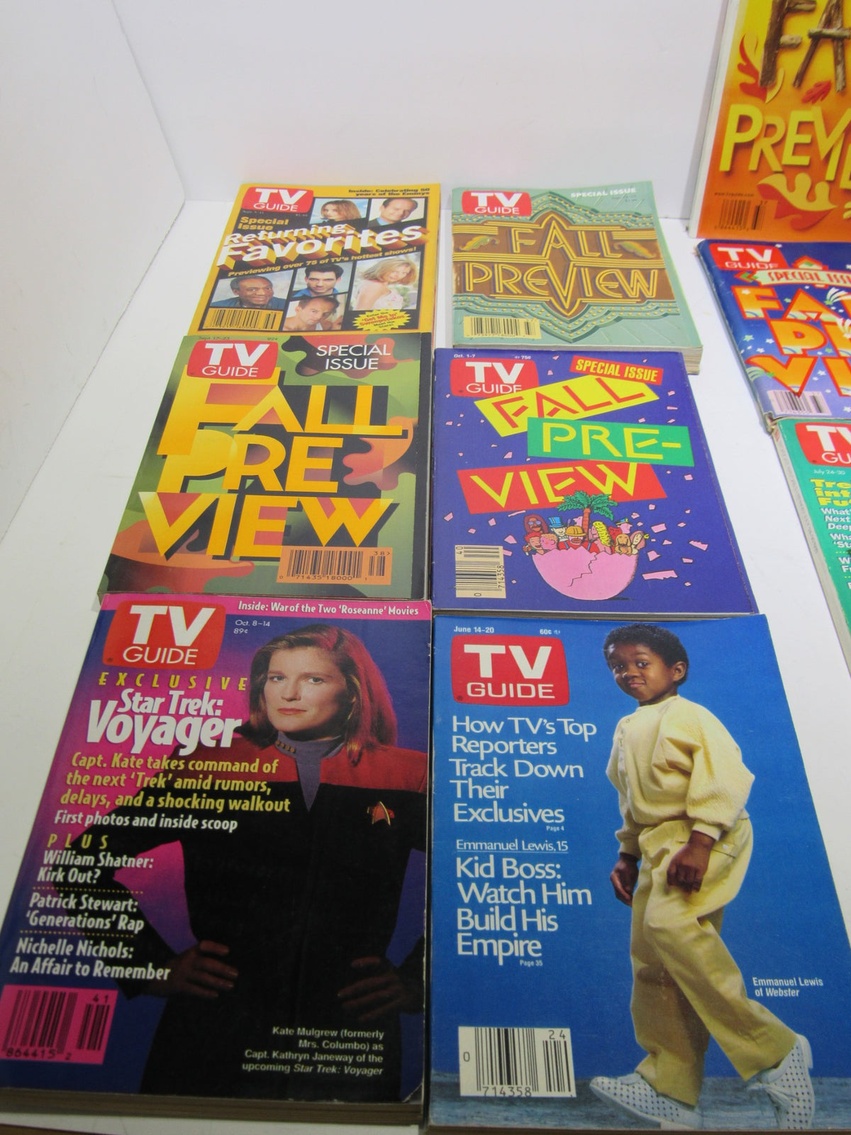 Close-up view of several TV Guide Magazines including Fall Preview and Special Issues, highlighting covers with iconic TV shows and actors.