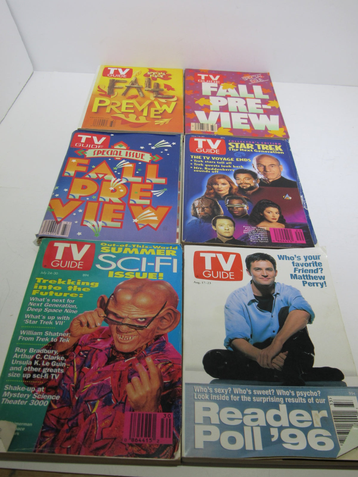 Display of TV Guide Magazines focusing on Fall Preview and Summer Sci-Fi Issues, featuring well-known shows and a Reader Poll issue, showcasing classic television.