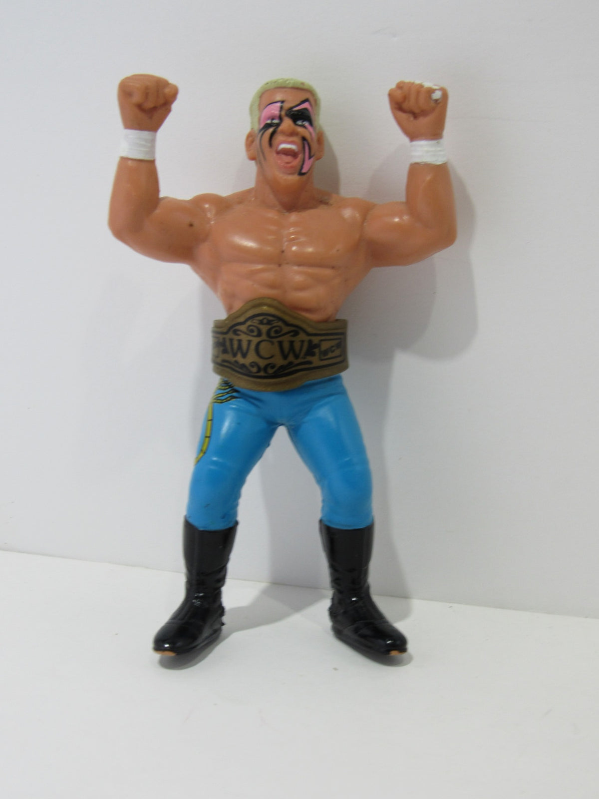 1990 WCW Galoob Sting with Belt Action Figure, showcasing the character's muscular build and vibrant attire.