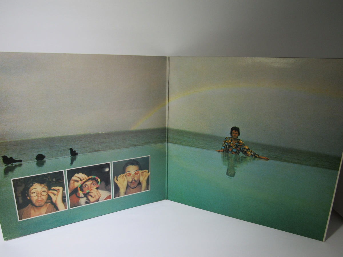 Inside spread of the 1980 Paul McCartney: McCartney II LP showcasing colorful images of Paul McCartney in a whimsical environment with a rainbow.