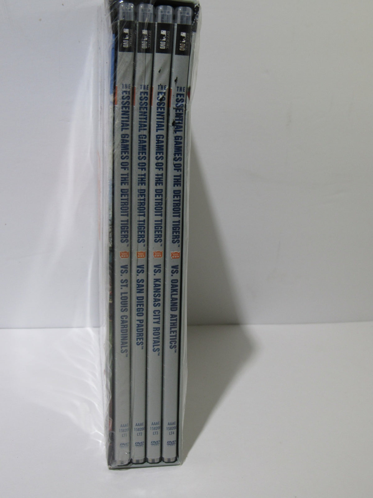 Side view of Essential Games Of The Detroit Tigers (2010) DVD box set displaying the titles of the four included DVDs.