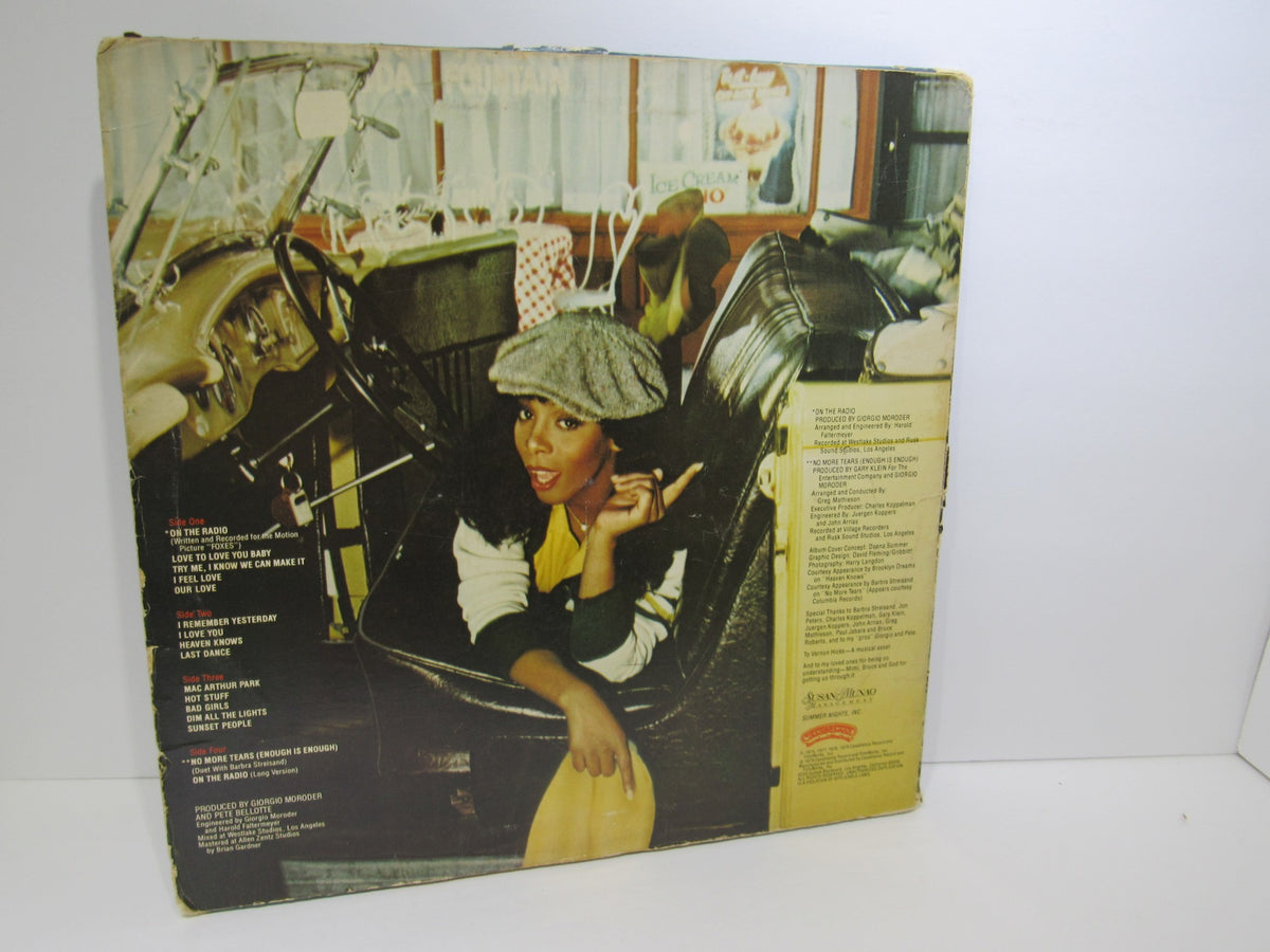 Back cover of the Donna Summer: Greatest Hits on the Radio LP, featuring an image of the artist and track listings.