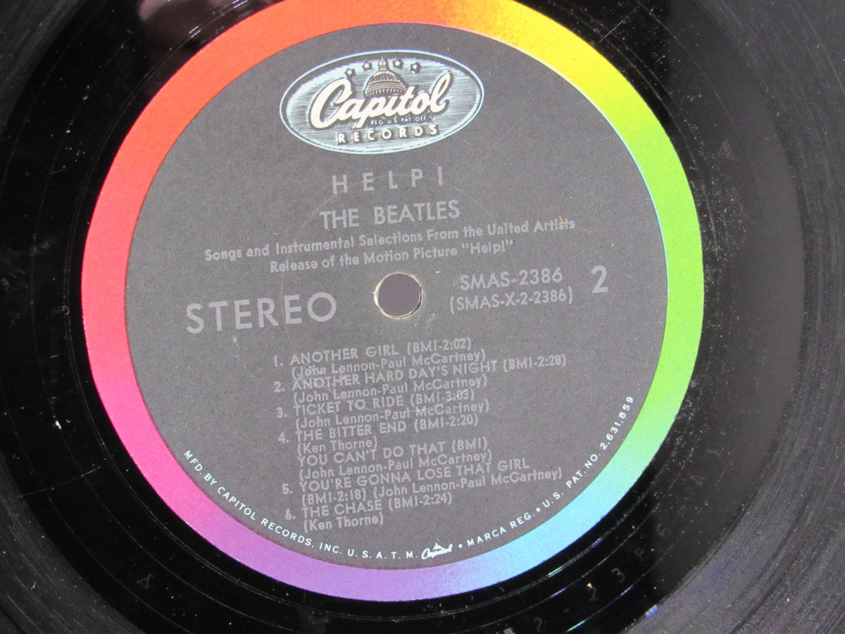 Detailed view of the label on The Beatles Help! OMPS/OST Capitol Gatefold Stereo LP SMAS 2386 illustrating track listings and artist information.