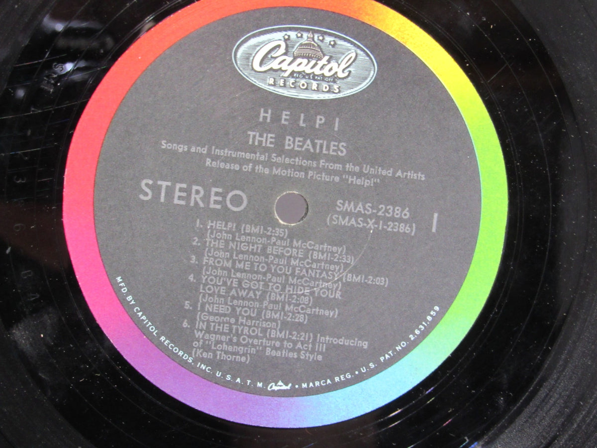 Close-up of The Beatles – Help! OMPS/OST Capitol Stereo LP label, SMAS 2386, featuring song titles and credits.