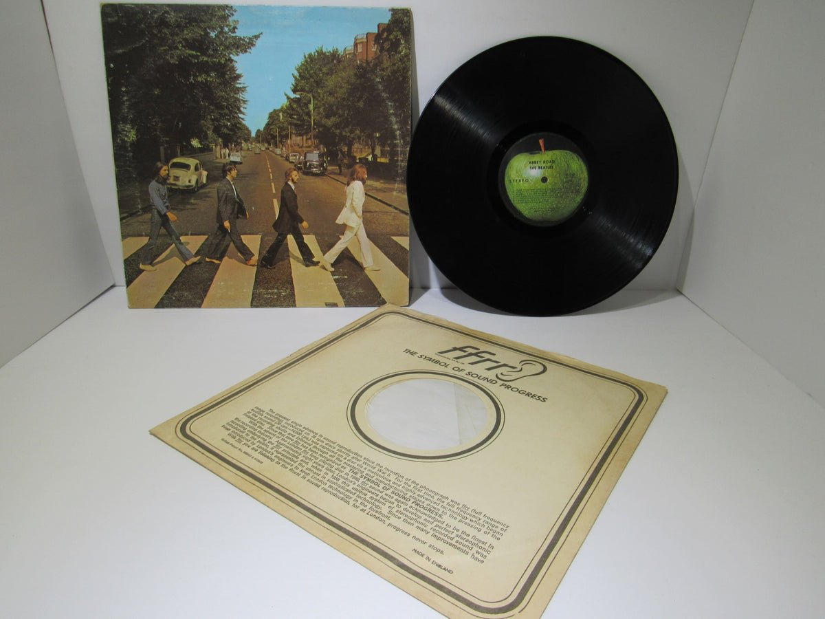 The Beatles: Abbey Road US Press Apple Records LP SO 383 Grade: G+ shown with its cover art and vinyl record in good condition.