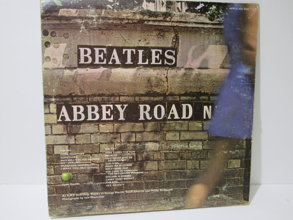 The Beatles: Abbey Road US Press Apple Records LP SO 383 back cover image showcasing the iconic band, track list, and album art details from the 1969 release, graded G+. Perfect for music collectors and Beatles fans.