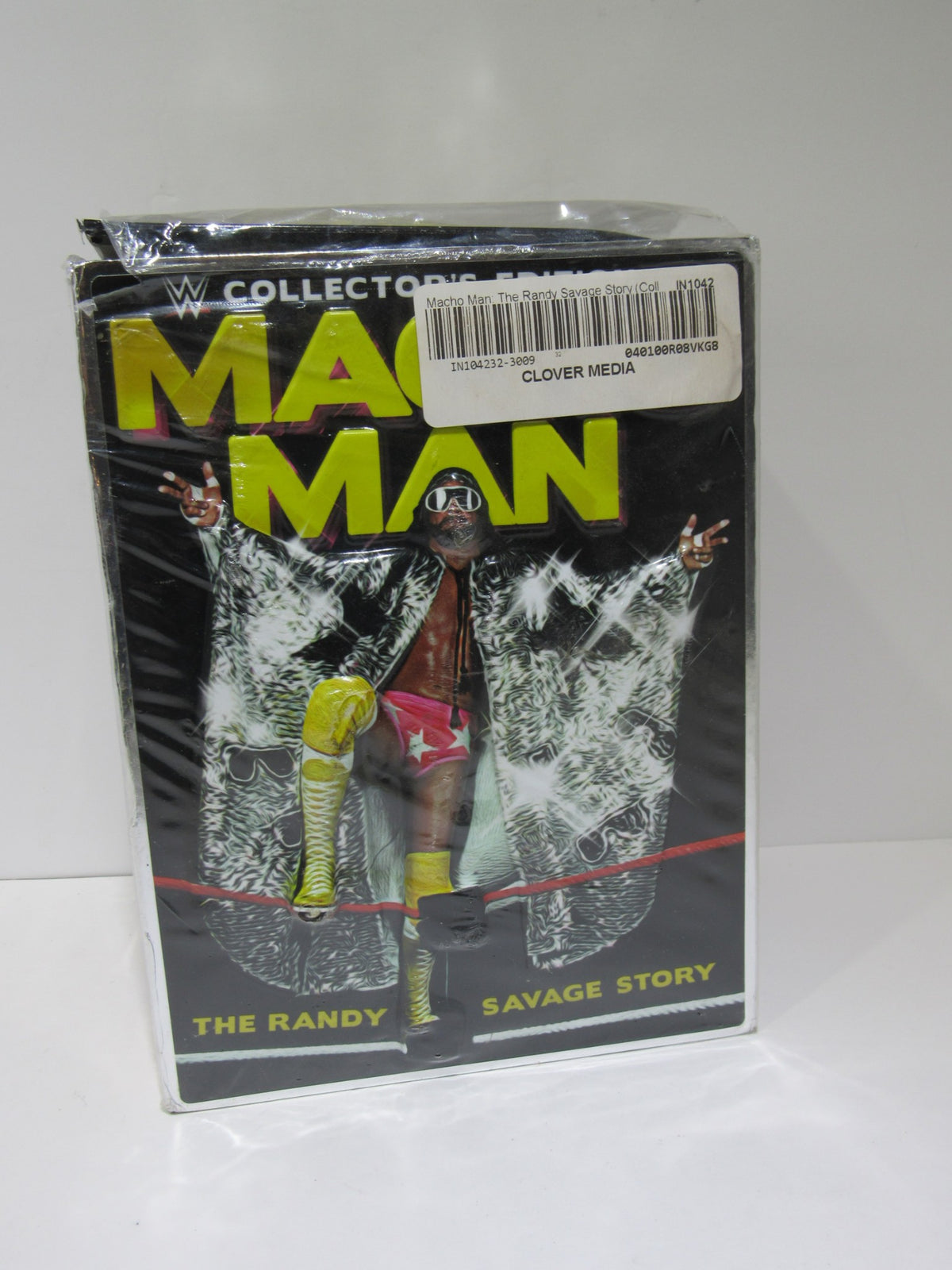 Macho Man: The Randy Savage Story Collector's Edition DVD cover featuring Randy Savage in a flashy costume, showcasing the iconic wrestling figure in a glamorous pose.