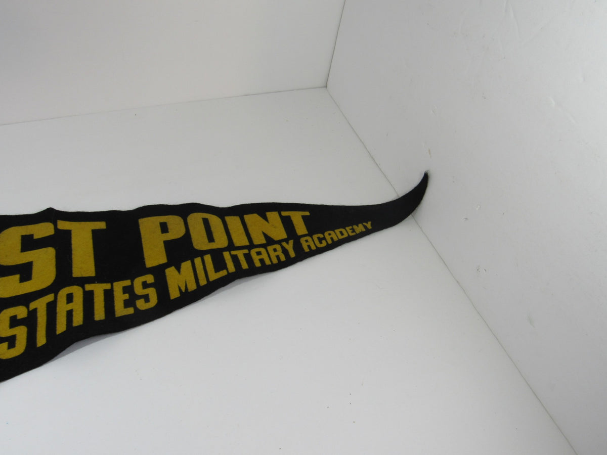 Vintage West Point United States Military Pennant Banner showcasing the text 'ST POINT STATES MILITARY ACADEMY' in bold yellow letters on a black background, featuring a triangular end.