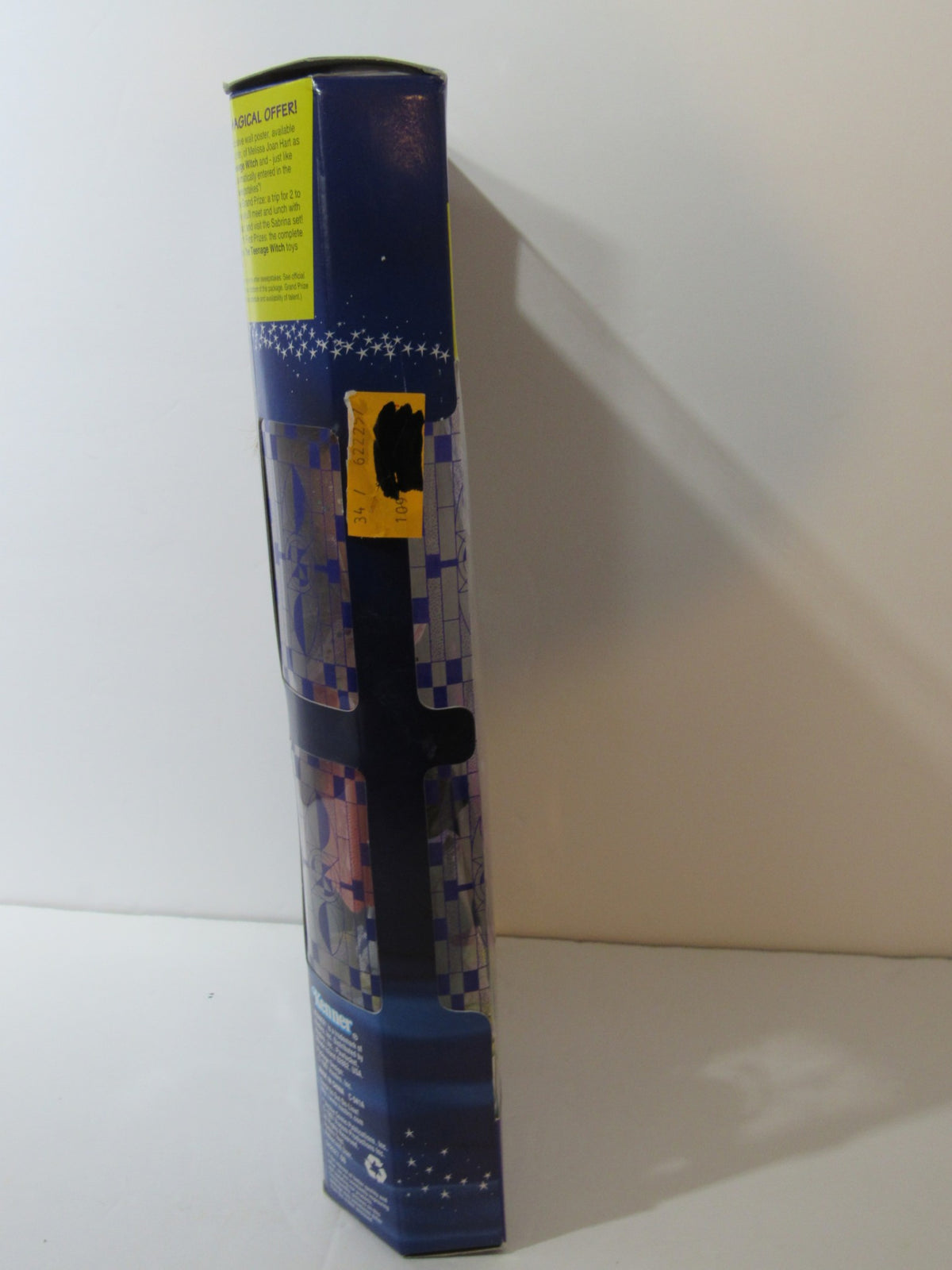 Side view of the box for the 1997 VTG Kenner Sabrina The Teenage Witch doll, highlighting the packaging design and promotional stickers.