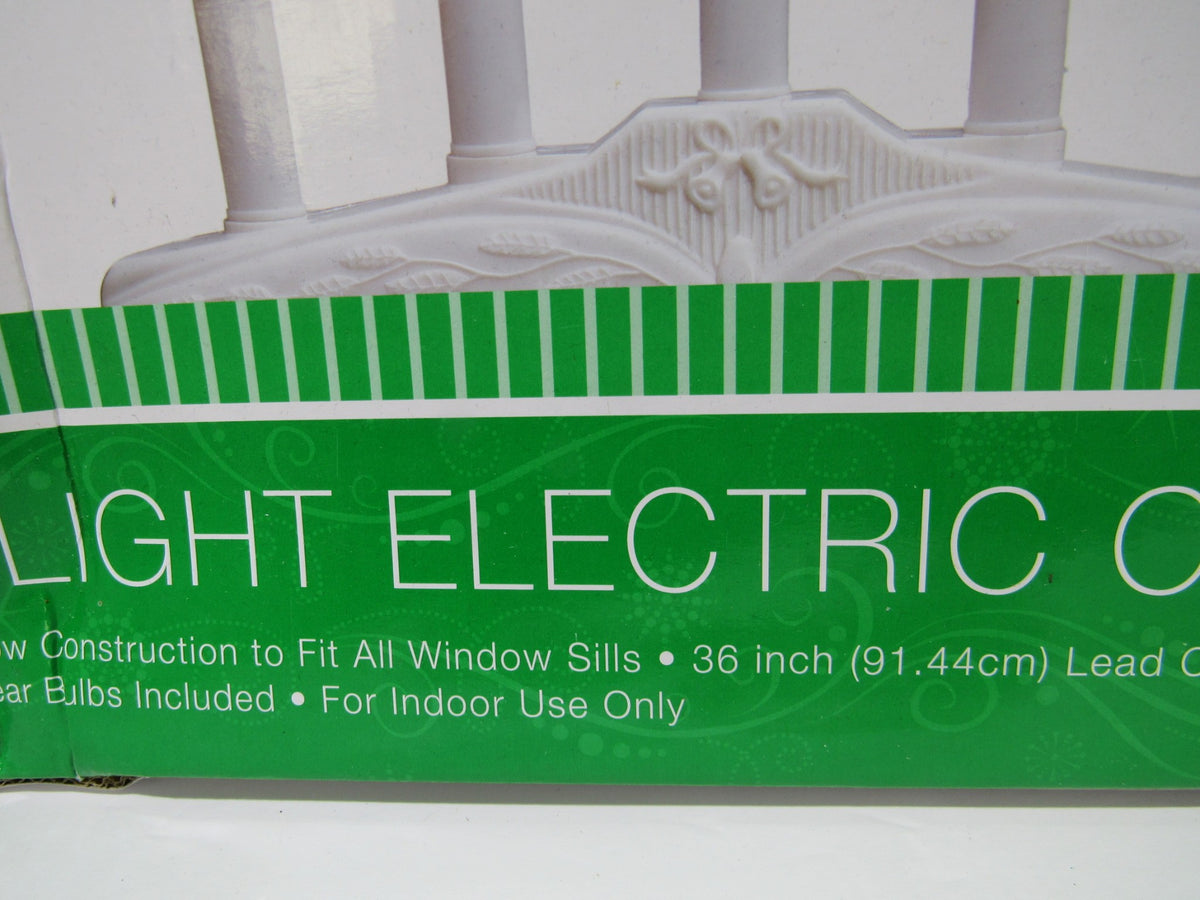 Close-up of Home Elements Beacon 5 Light Electric Window Candolier packaging highlighting features such as narrow construction and included clear bulbs.